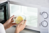 Use Good Housekeeping Seal Star Mr. Clean Magic Eraser to Rid Your Microwave of Stuck-On Food